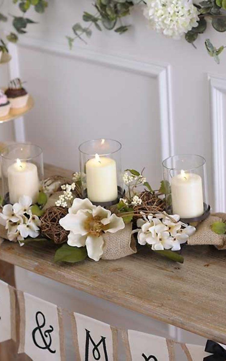 cente de table mariage printemps en bougies et fleurs de magnolia ambiance rustique