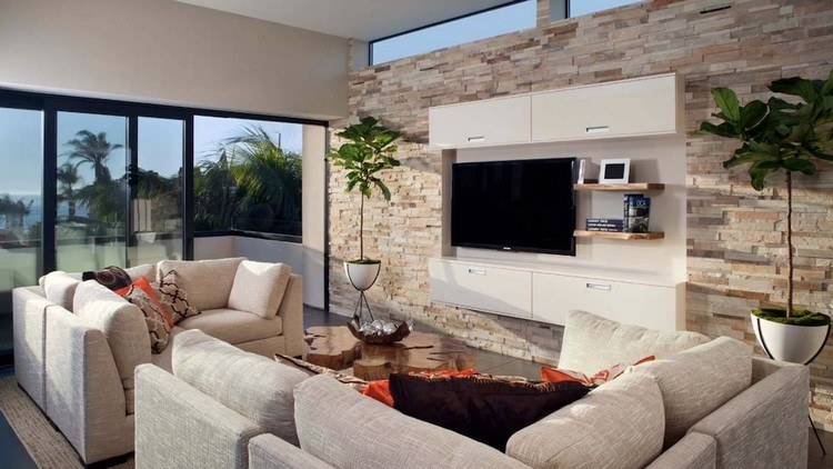 salon moderne commode TV design sur un mur en pierre naturelle