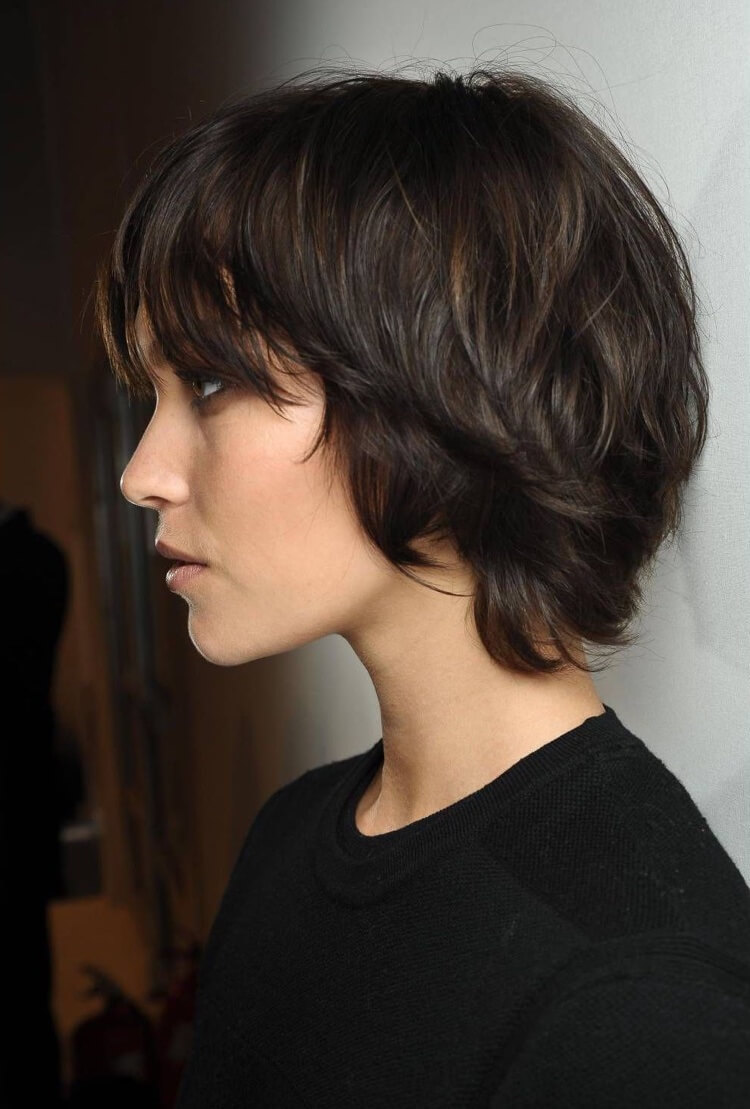 Autumn trend woman hairstyle 2021 long pixie cut with bangs