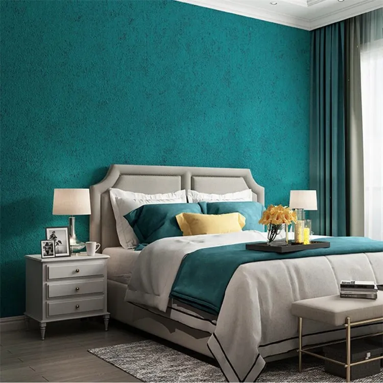 chambre à coucher avec papier peint turquoise