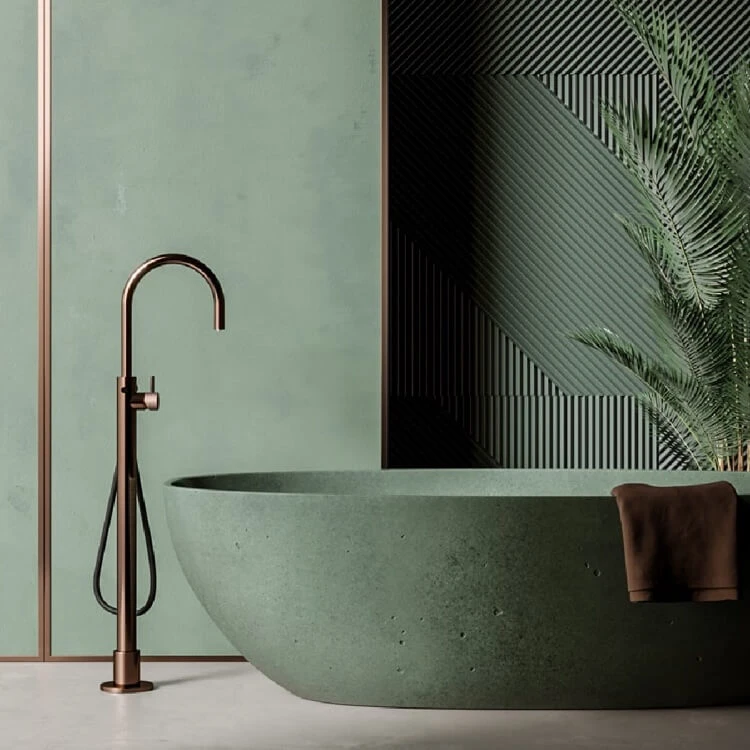 salle de bain de style biophilique couleur de peinture vert doux tuyauterie en cuivre brossé palmier en pot