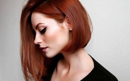 carré plongeant asymétrique mi-long coloration cuvre coupe dramatique chic