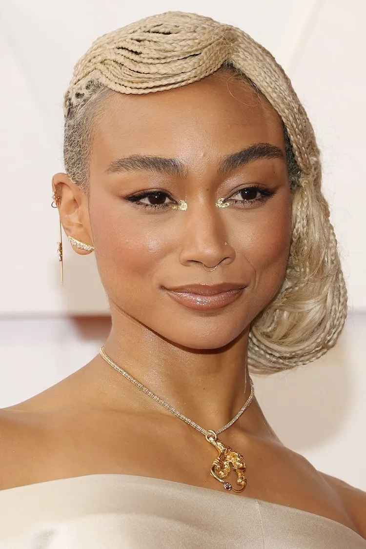 Tati Gabrielle Hairstyle with Blonde Braids Tied in Low Side Bun