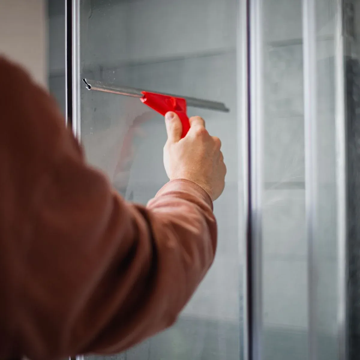 nettoyer porte de douche coulissante