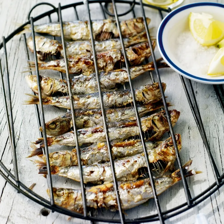 grilled sardines on the barbecue garlic combination olive oil lemon juice mediterranean cuisine