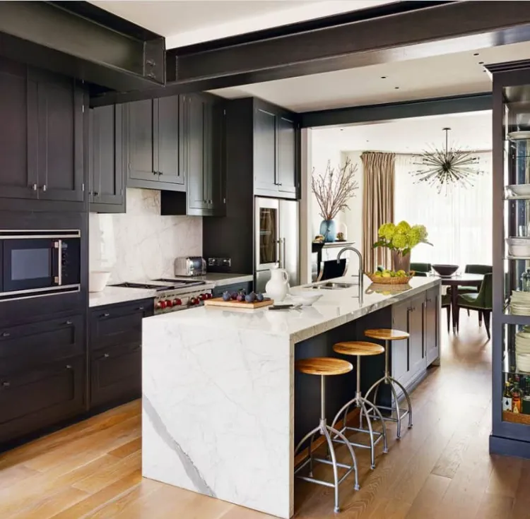 kitchen trends 2022 matt black cabinets wooden floor white marble island