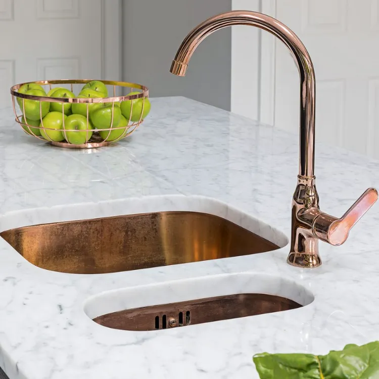 kitchen trends 2022 old style metal faucet white marble worktop