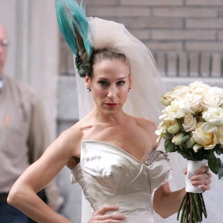Carrie Bradshaw wedding hairstyle with feathers