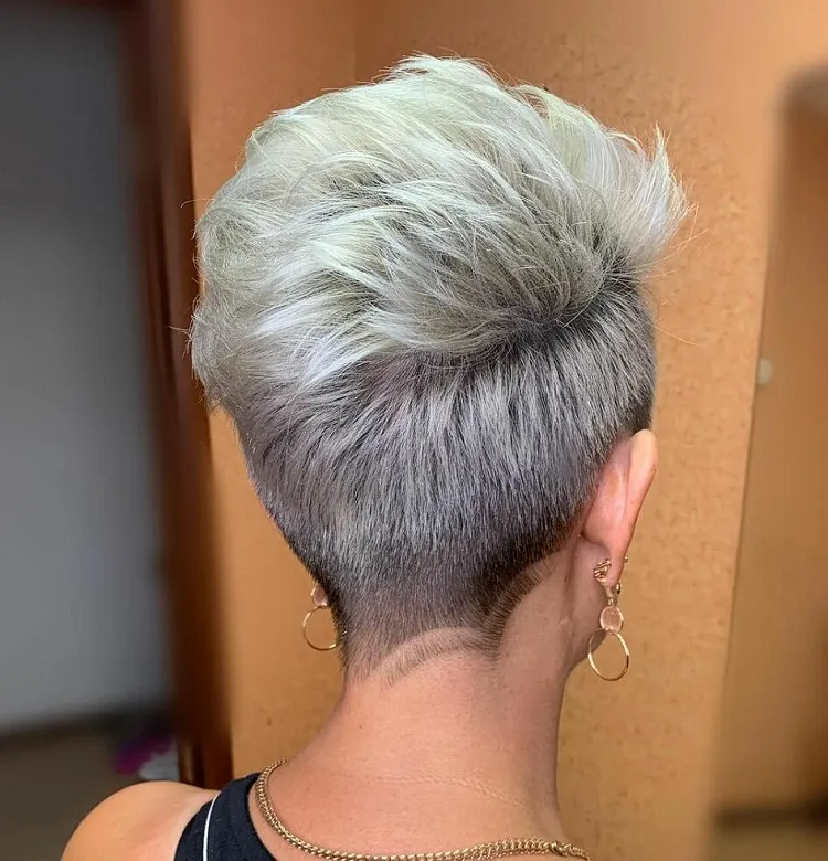 Pixie cut with undercut on silver colored hair