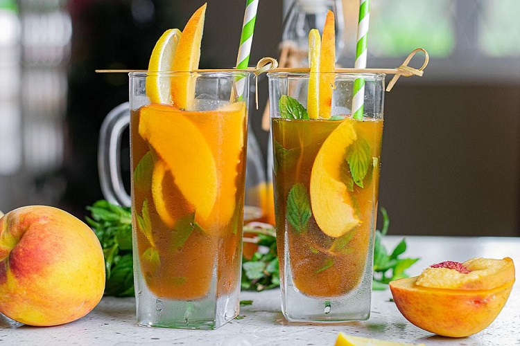 summer cocktail with peaches and vodka