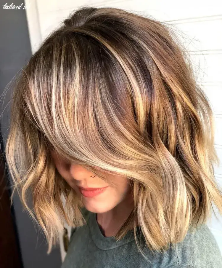 A short, medium length tapered square with a golden blonde color sweeping over