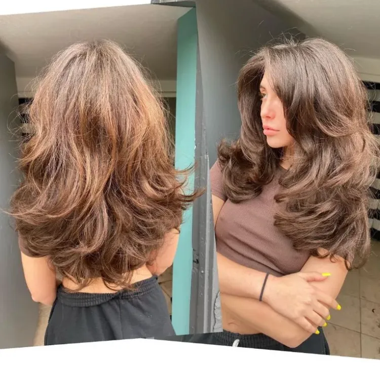Long haircut for women in the shape of a butterfly, thick hair, summer 2022