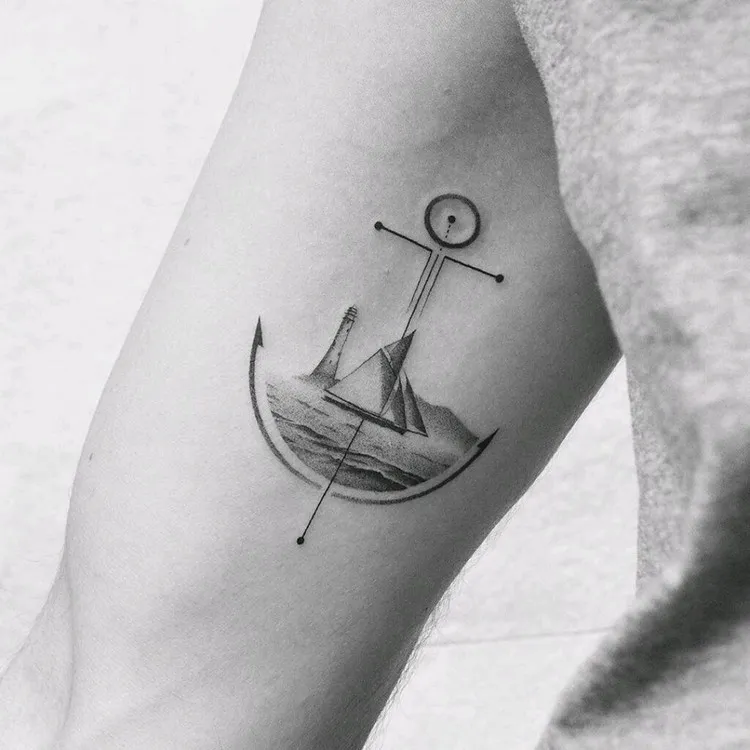 tatouage géométrique homme avant bras ancre bateau