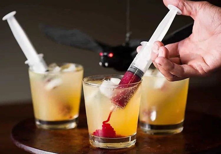 Halloween cocktails with syringe versions with and without alcohol