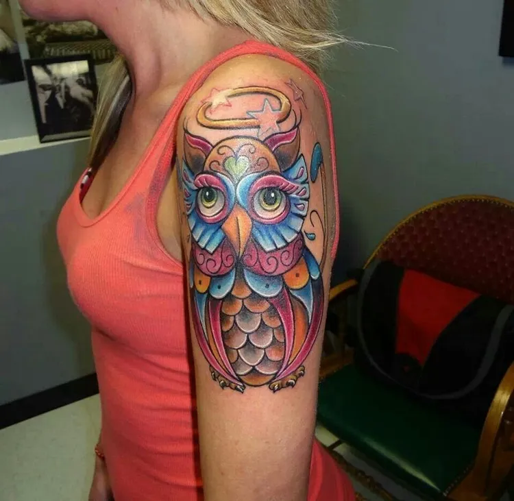 colorful realistic owl tattoo on arm