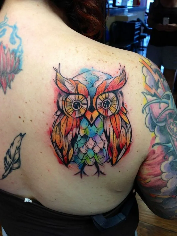 watercolor woman owl tattoo on the shoulder blade colorful tattoo