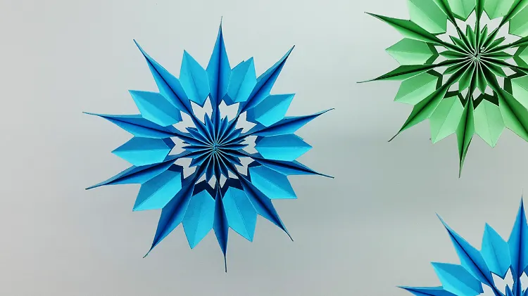 flocons de neige en papier couleur comment faire étapes tuto vidéo facile