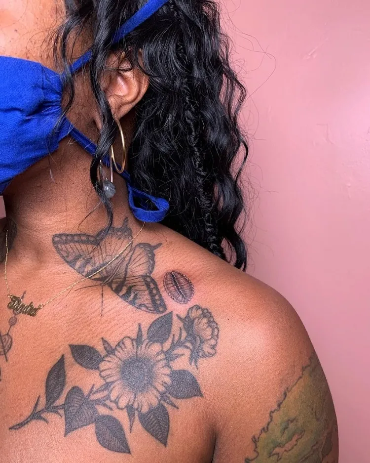 tatouage bras potrine femme noire peau métisse
