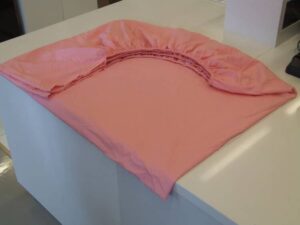 comment plier un drap housse correctement