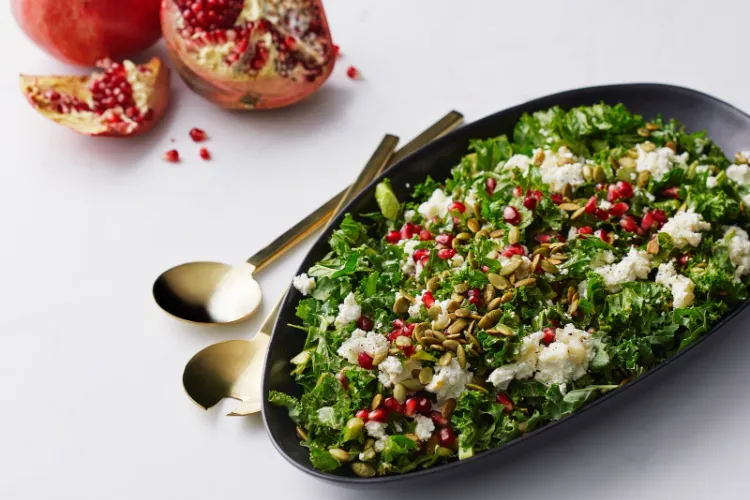 winter salad consisting of kale pomegranate goat cheese easy to satiate