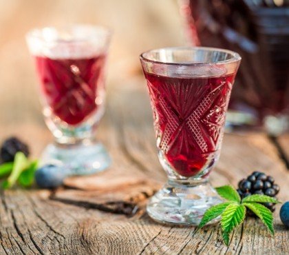 healthy liqueur with alcohol and berry fruits
