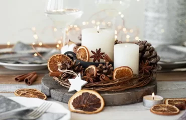 centre de table naturel pour noël déco avec oranges séchées pommes de pin bougies