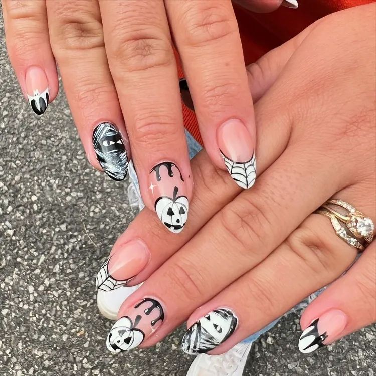 une idée originale de nail art halloween avec le motif de jack o' lantern