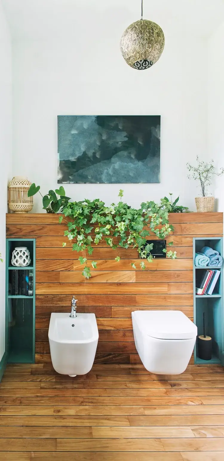 petite salle de toilettes stylée avec des plantes vertes en tant que décoration