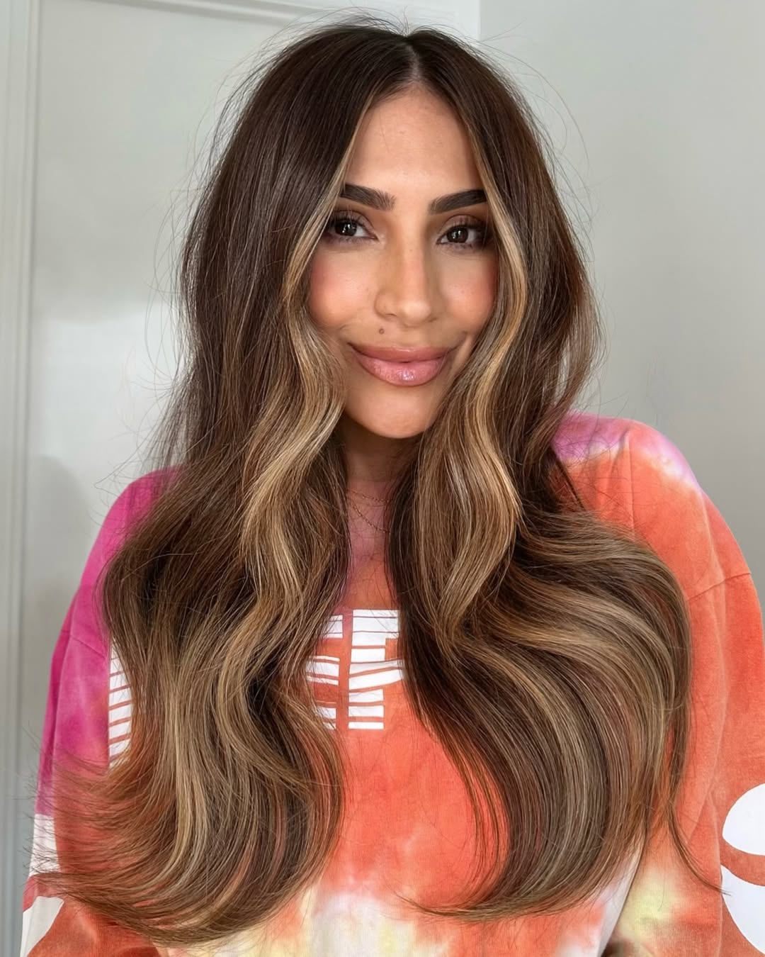la coloration money piece caramel sur une base brun foncé