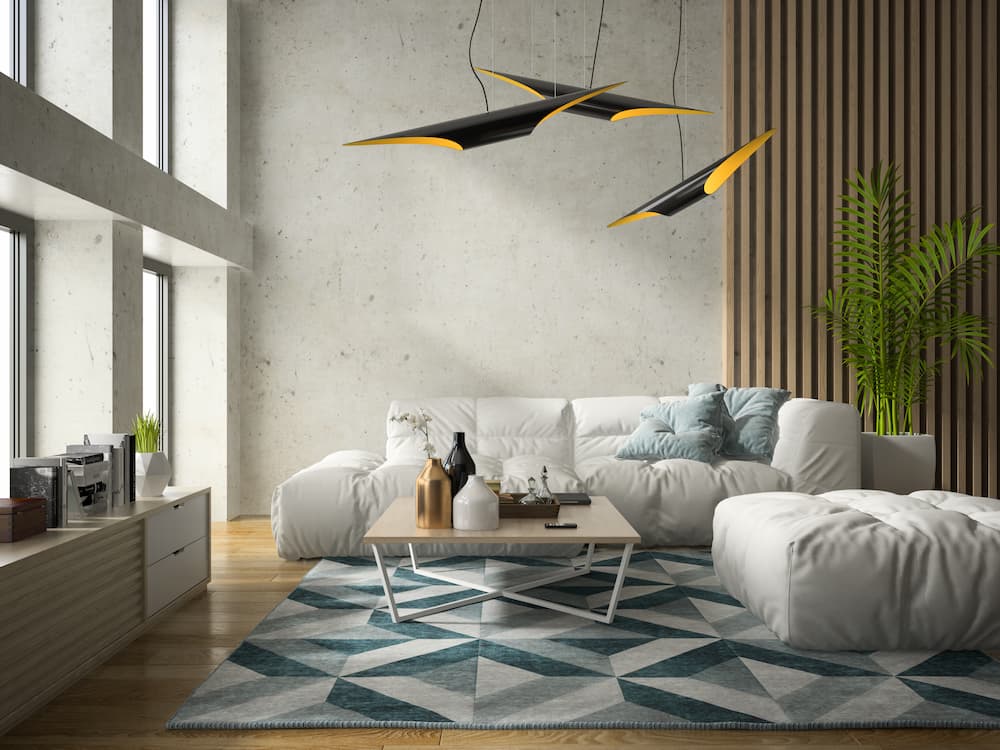 suspensions noires et dorées au design futuriste apportant une lumière directionnelle élégante